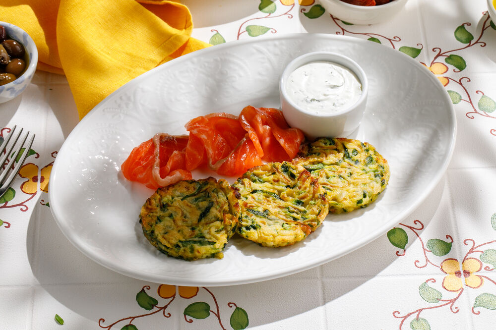 Zucchini fritters with salmon and buttercream