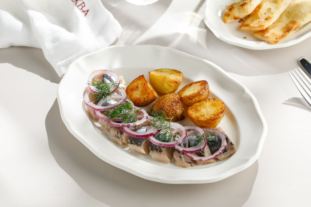 Olyutorskaya herring with baked potatoes