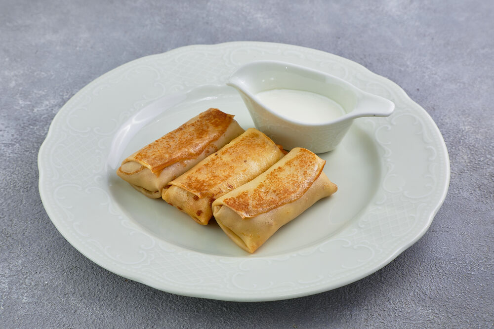 Crepes with meat and sour cream