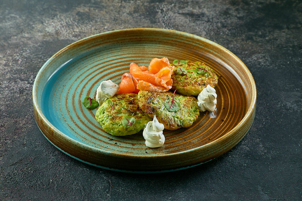 Zucchini pancakes with salmon and butter cream