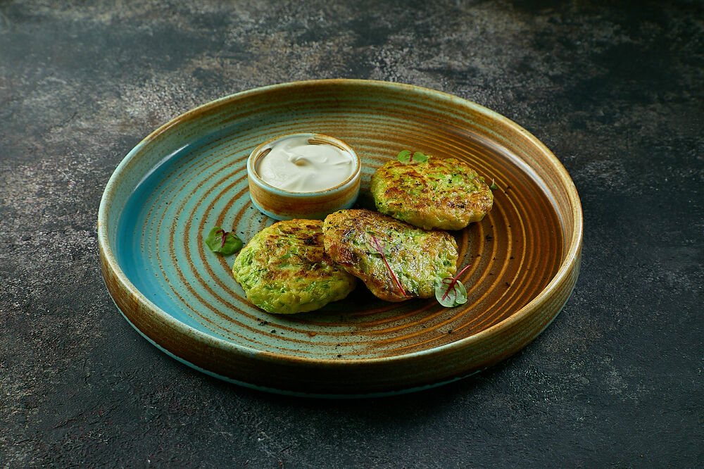 Zucchini pancakes with sour cream