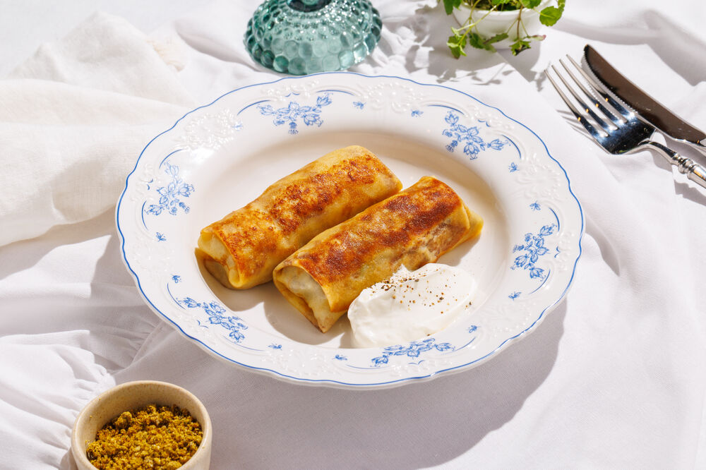 Pancakes with meat and sour cream