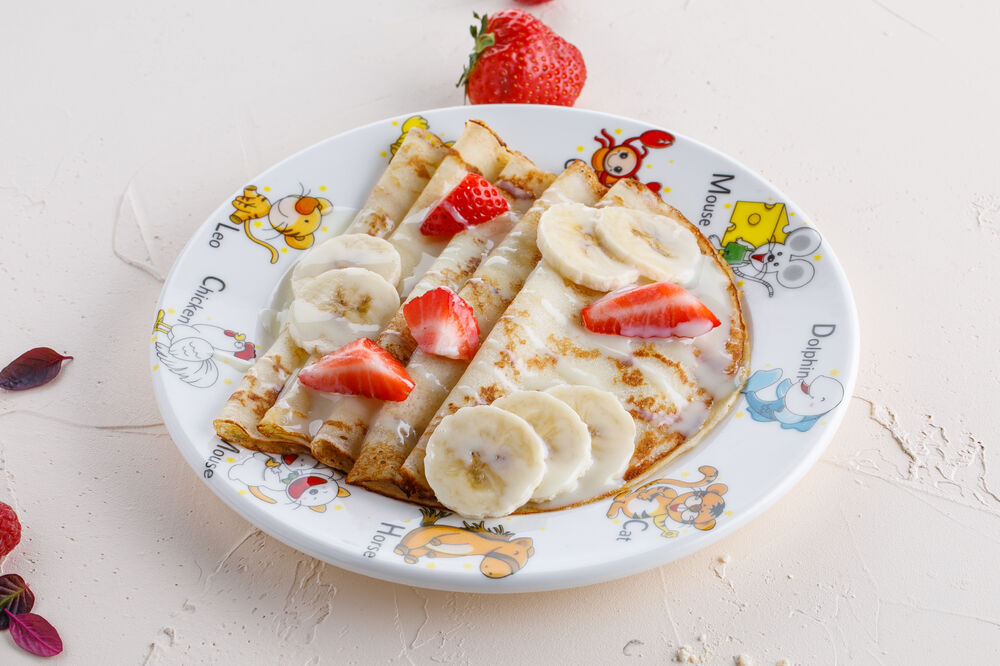 Pancakes with banana and condensed milk for children
