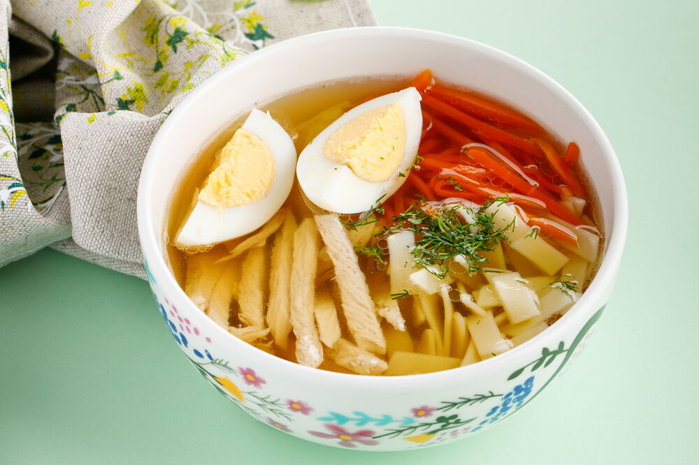 Broth with homemade noodles and chicken fillet 