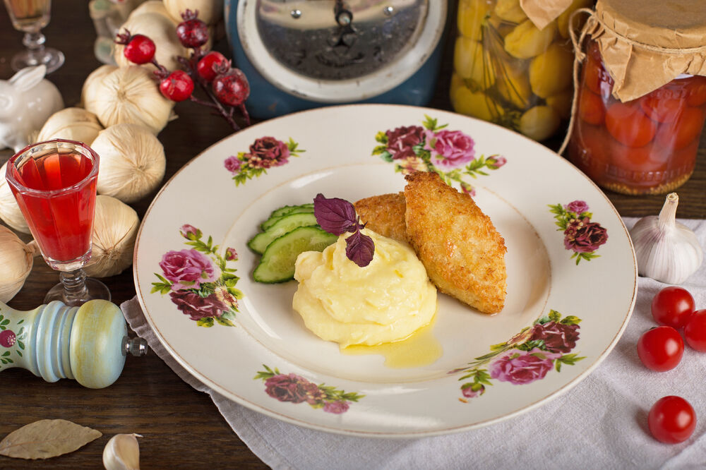Atlantic cod cutlets with mashed potatoes and light-salted cucumber