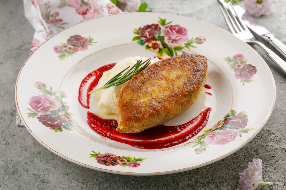 Elk cutlet with sauerkraut and mashed potatoes