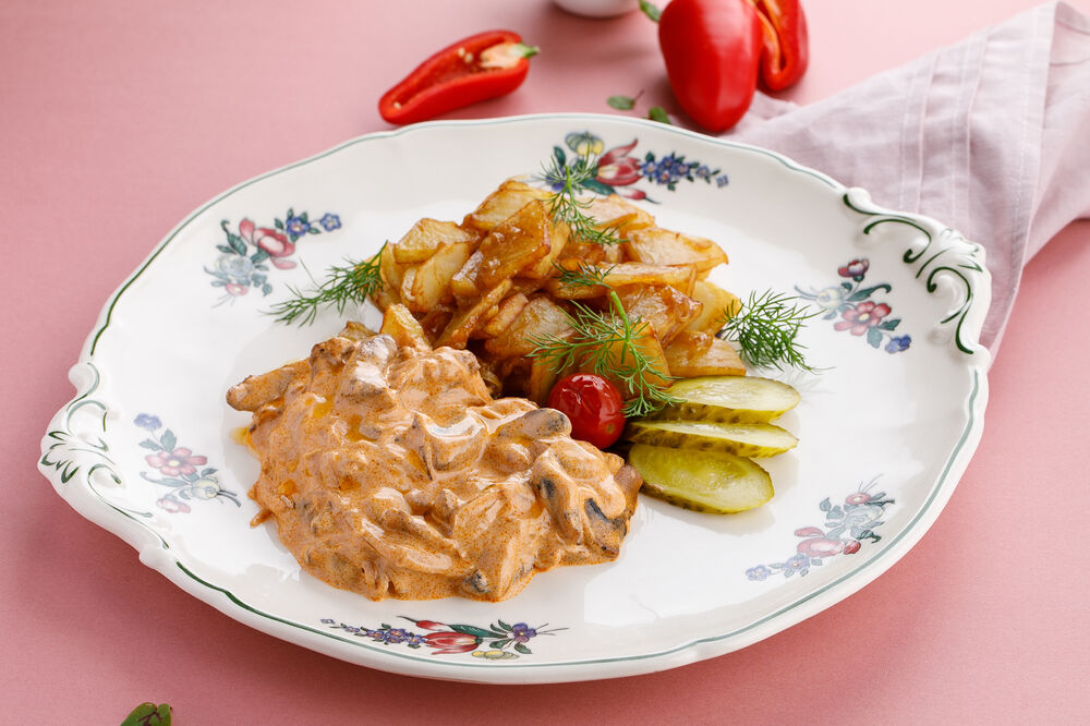 Beef Stroganoff with pickled cucumbers  and  fried potatoes