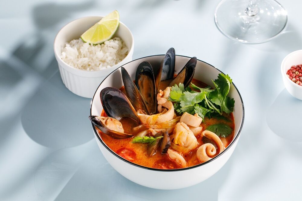 Tom Yam soup with seafood and coconut milk