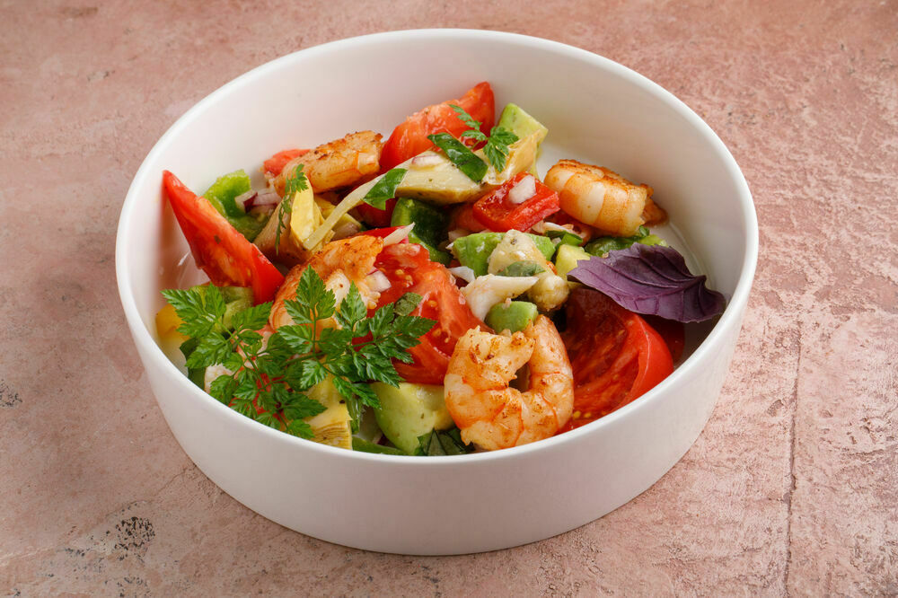 Vegetable salad with crab meat and grilled shrimps