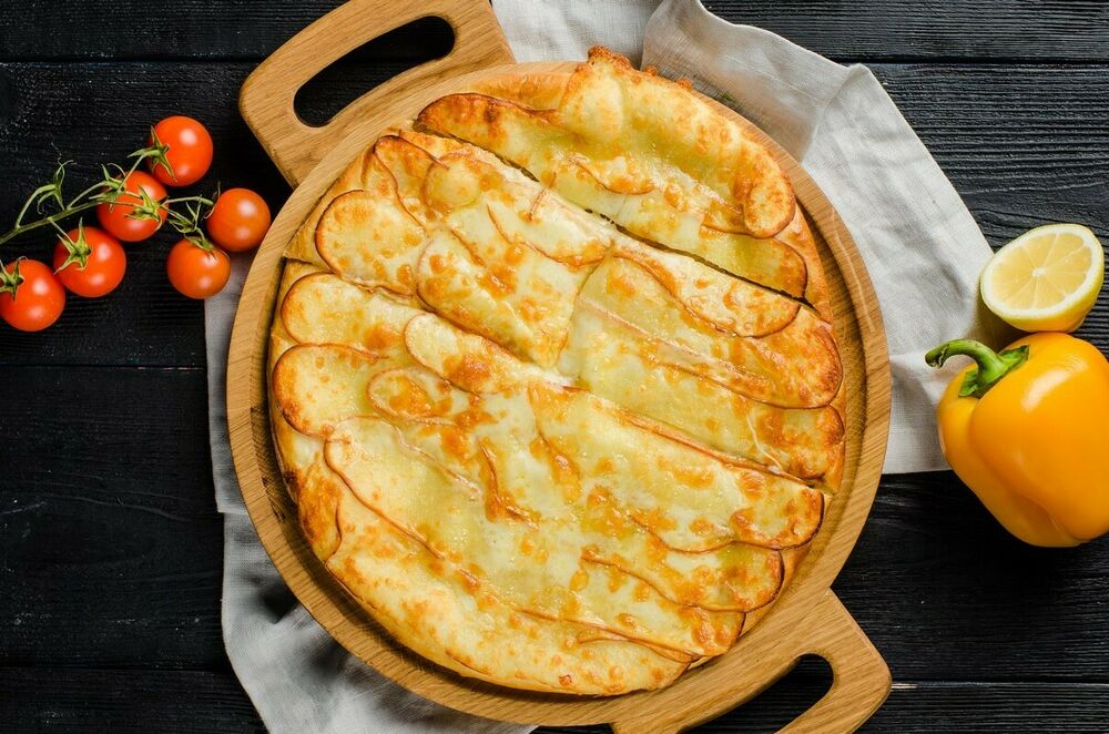 Khachapuri with smoked Suluguni cheese