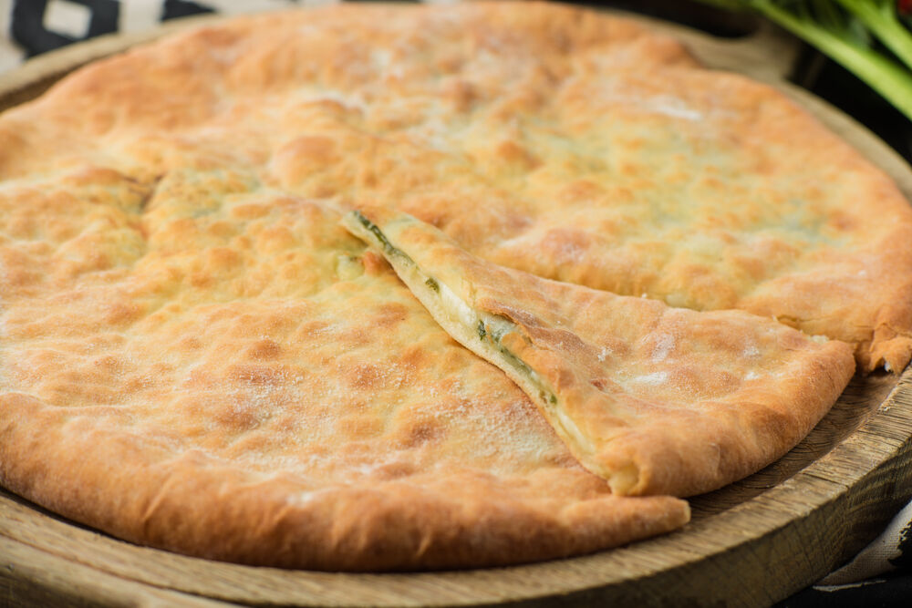 Khachapuri with spinach and Suluguni cheese
