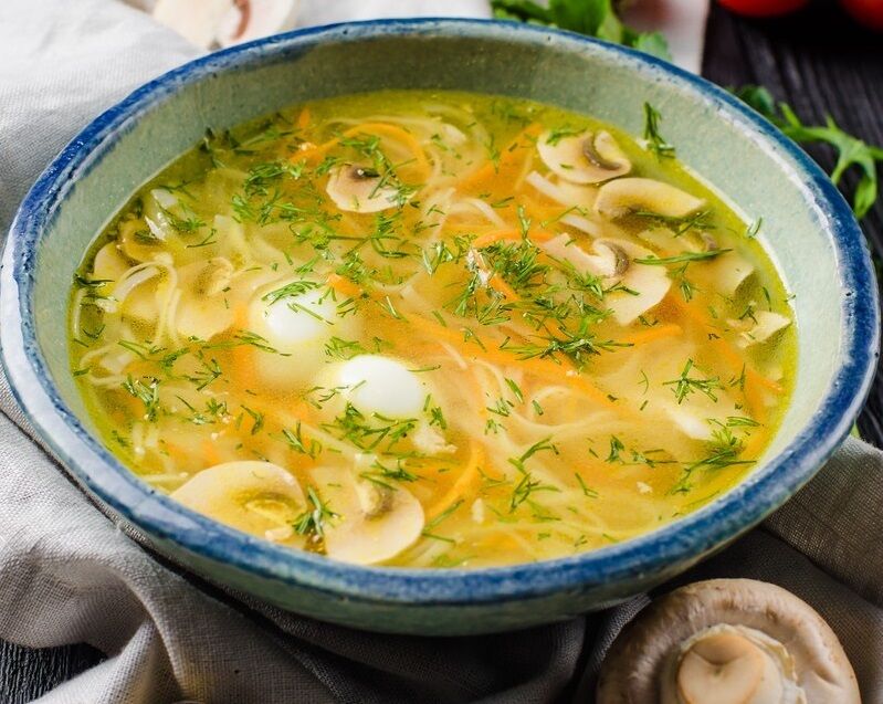 Homemade noodle soup with chicken and mushrooms
