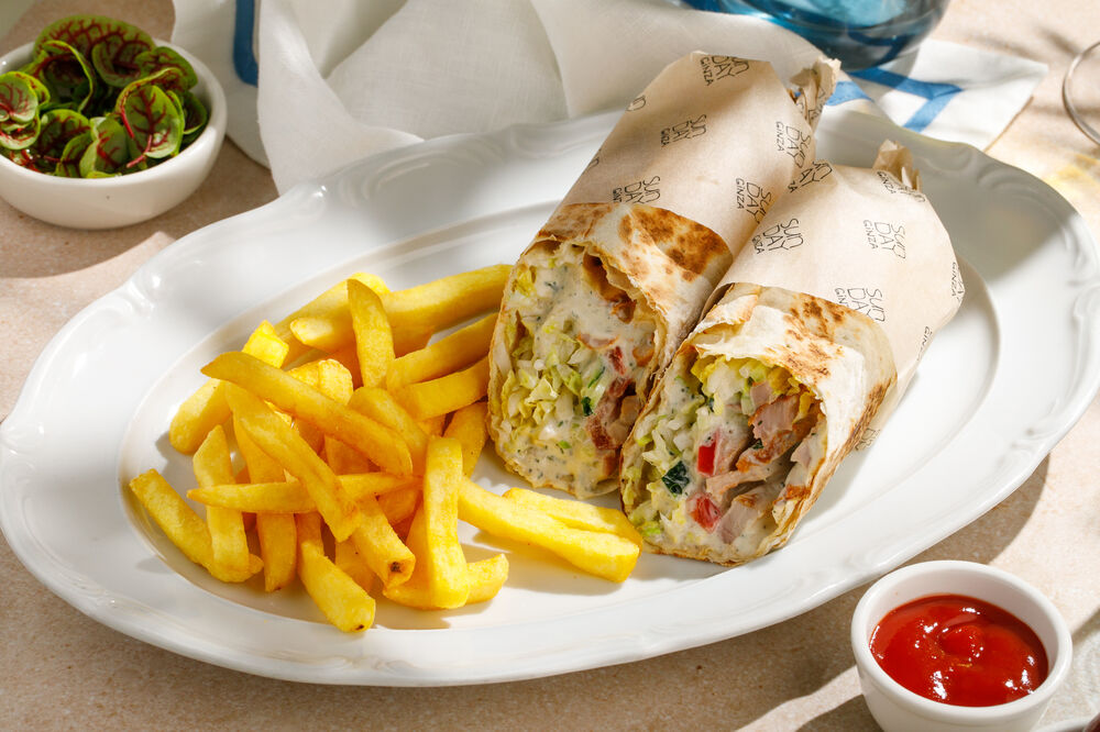 Shawarma with chicken leg quarter and French fries