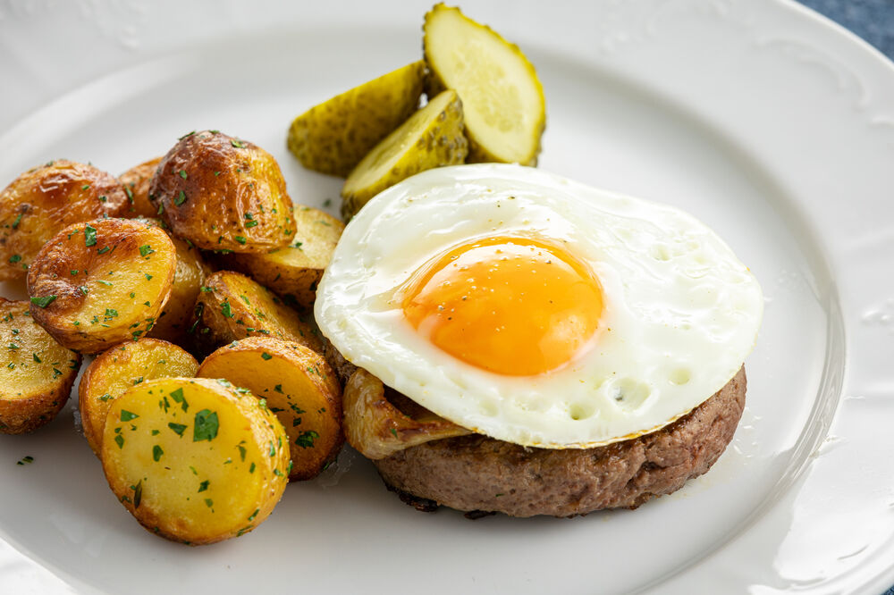 Steak with egg and fried potatoes