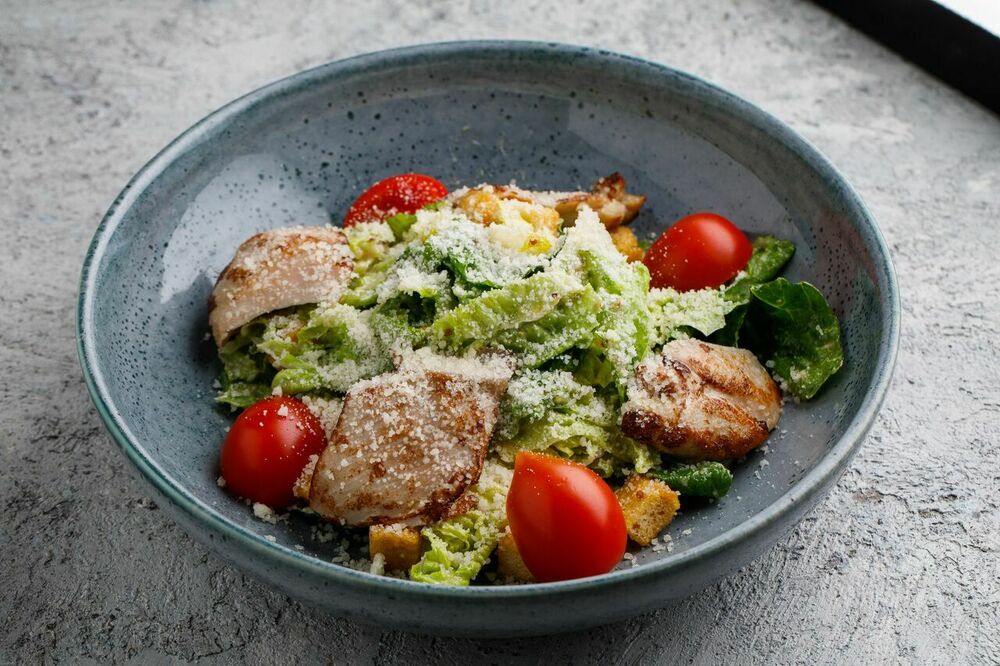 Caesar salad with chicken thigh