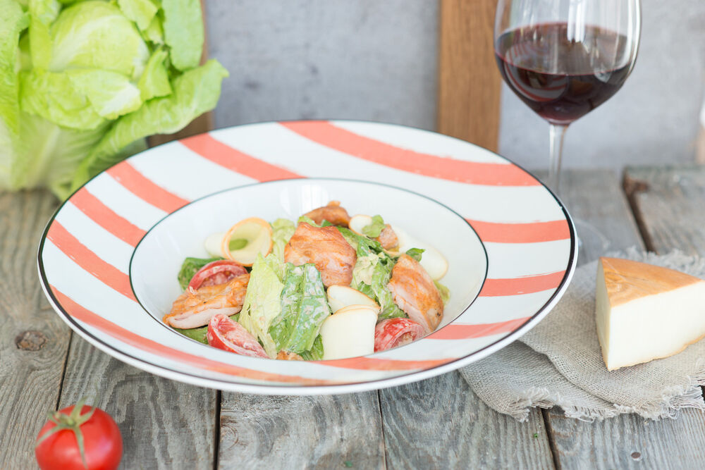 Warm salad with chicken and smoked Suluguni