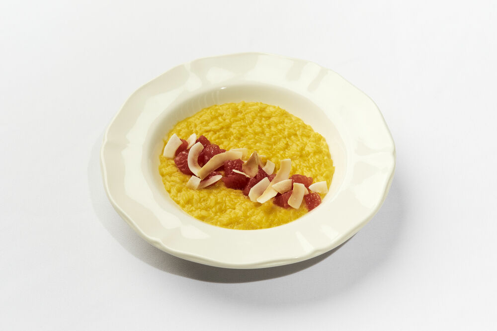 Coconut milk rice porridge with mango puree and grapefruit