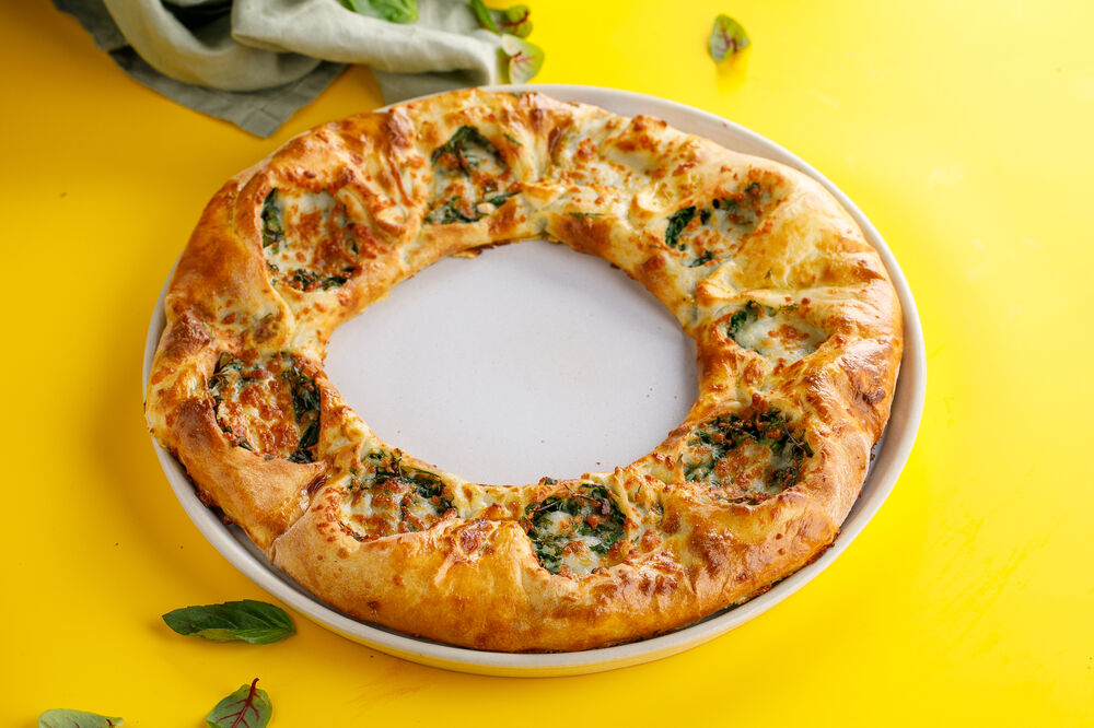 Khachapuri with cheese and greens