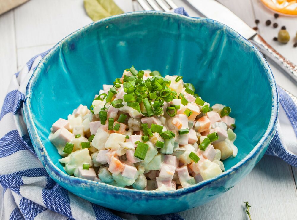 Russian salad Olivier with salted cucumbers