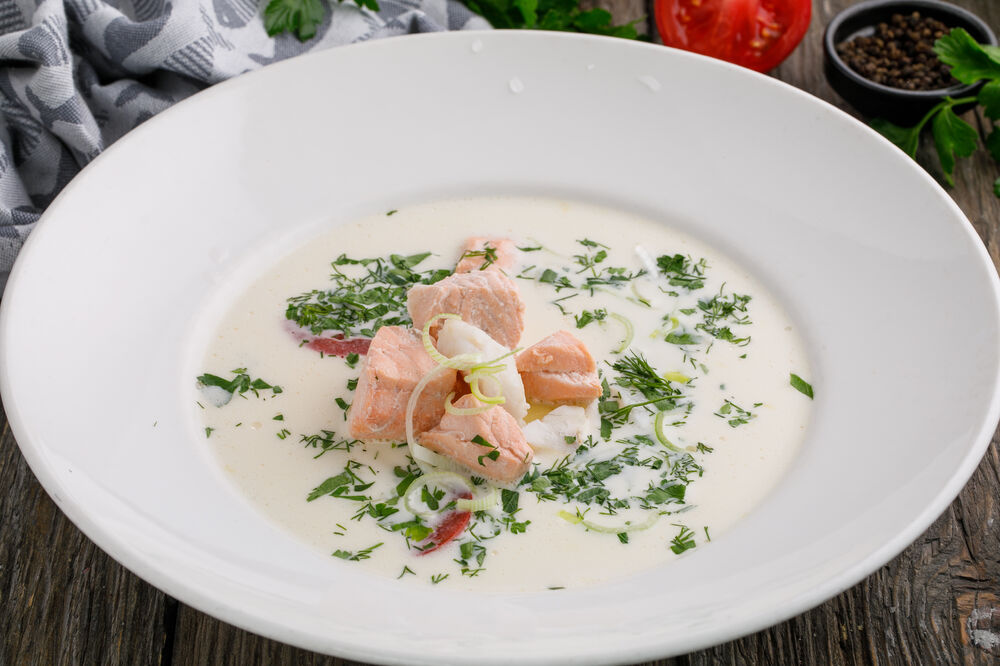 Fish soup with salmon, cod, with cream and dill