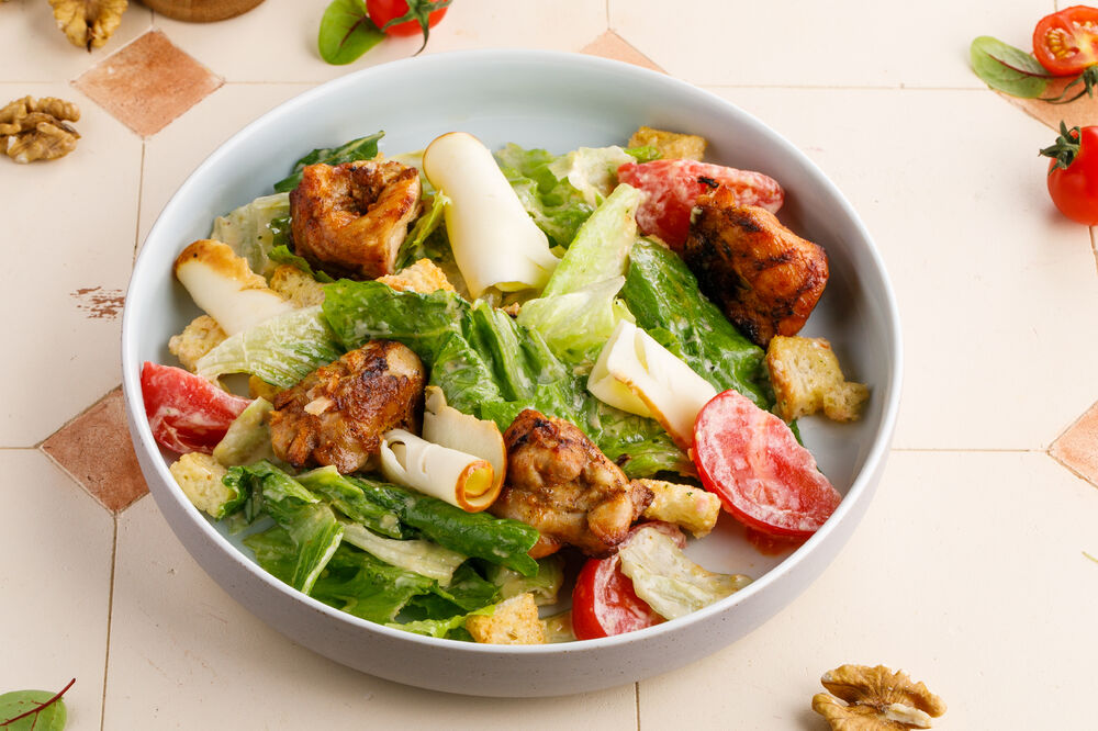 Warm salad with chicken and smoked suluguni cheese