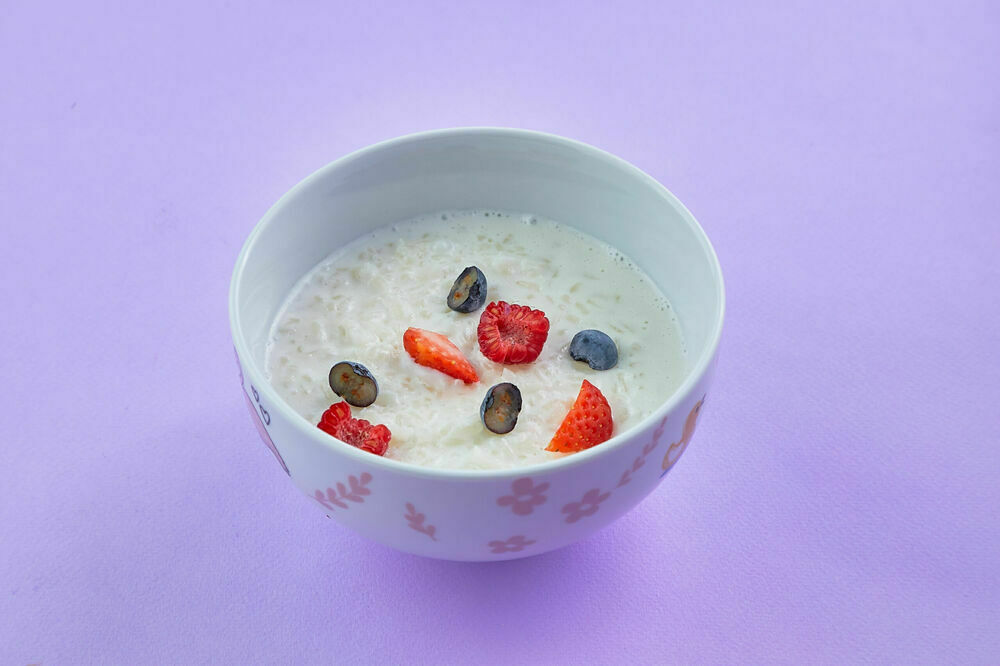 Rice porridge with berries and milk 