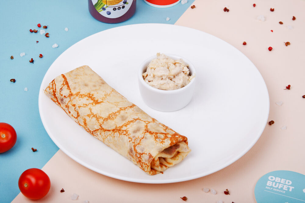 Big pancake with a chicken in cream
