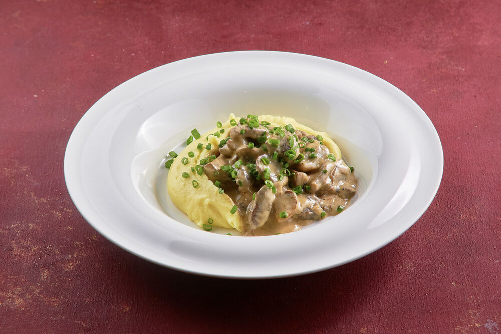 Beef stroganoff with beef sirloin with mushrooms and mashed potatoes