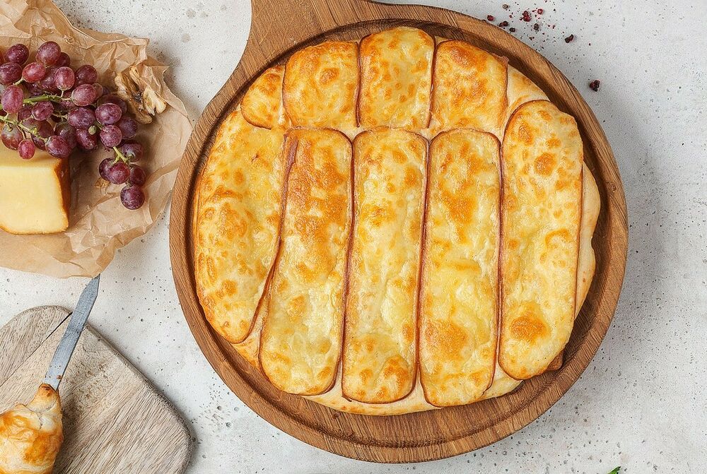 Khachapuri with smoked Suluguni cheese