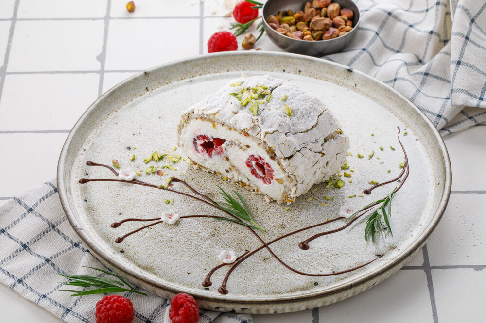 Dessert Pistachio roll with raspberries