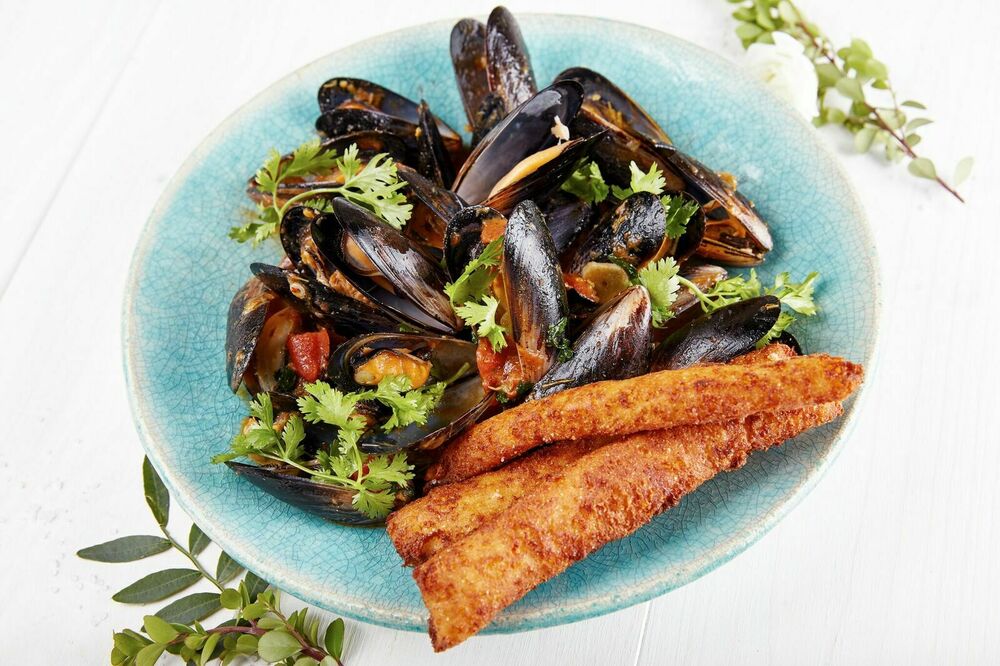 Black Sea mussels with adzhika, jonjoli and tomatoes