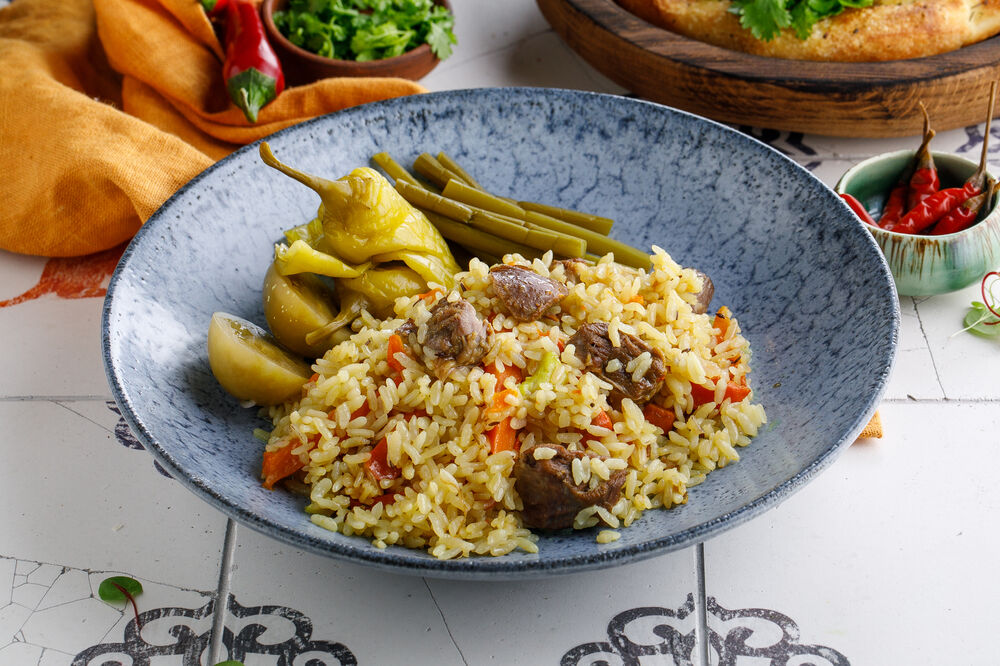 Uzbek pilaf with lamb and pickles