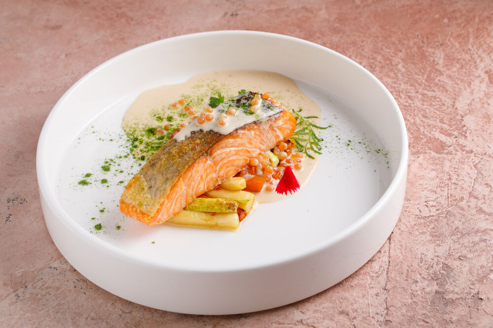 Salmon in caviar sauce with vegetables in a sweet chili sauce