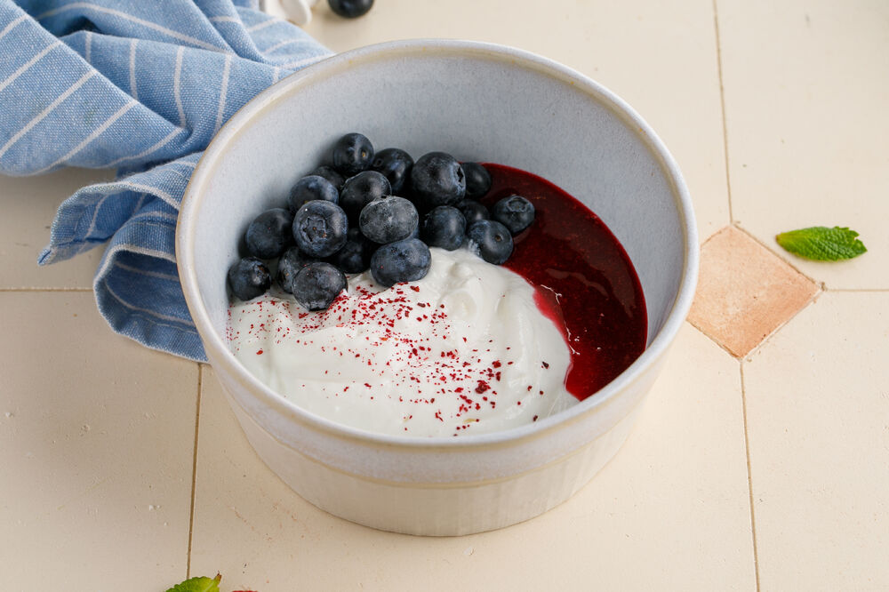 Matsoni with raspberry jam and berries