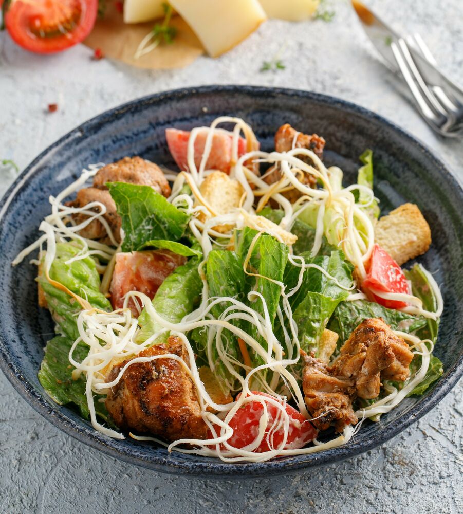 Warm salad with chicken and cheese