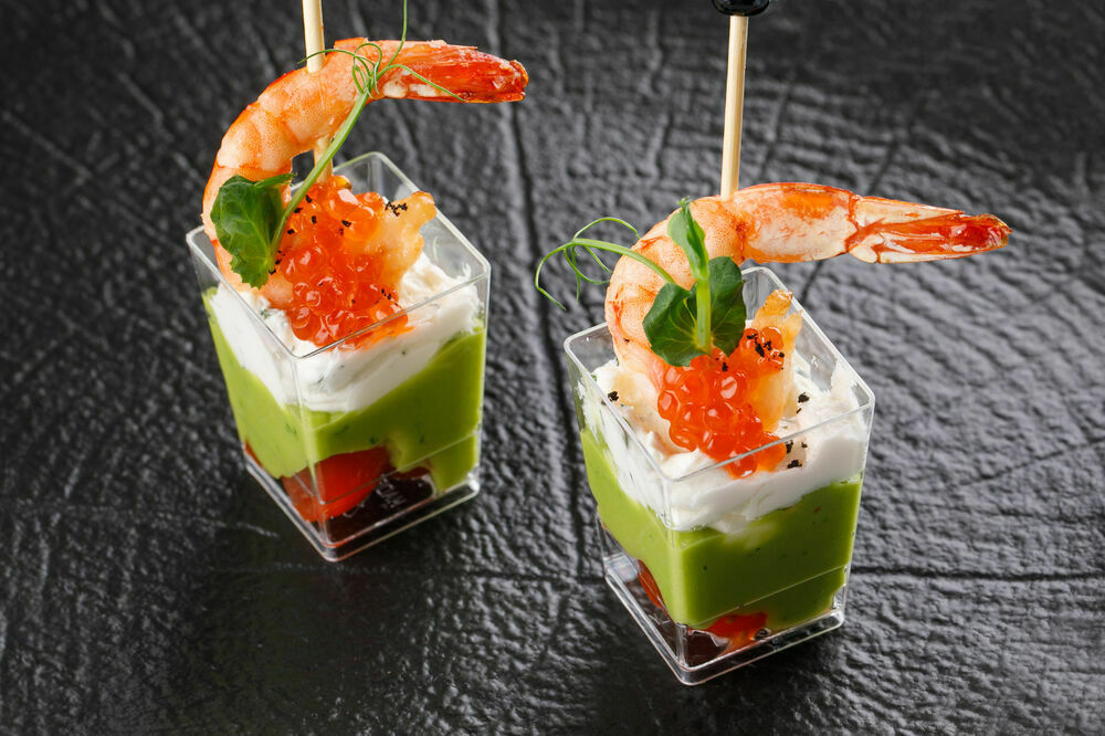 Shot with shrimp, red caviar and guacamole