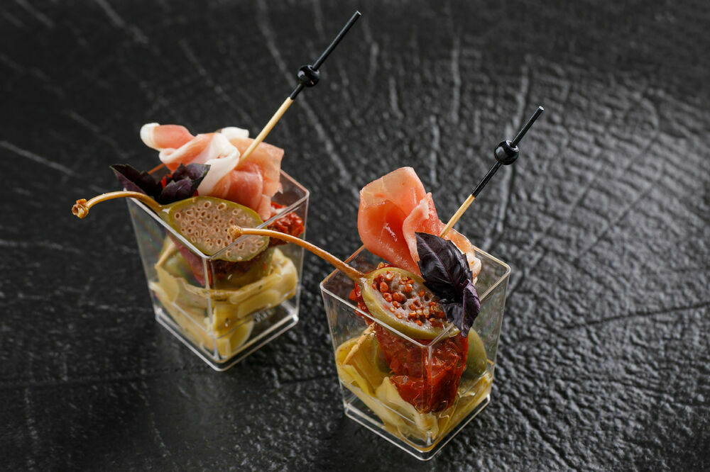 Canapes with antipasti and prosciutto