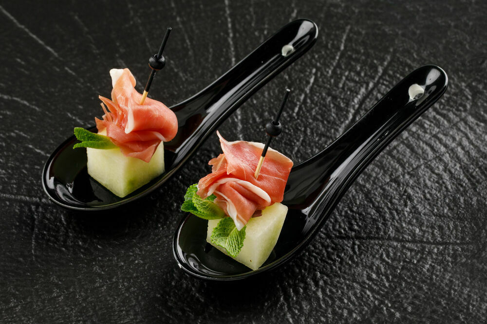 Canapes with melon and prosciutto