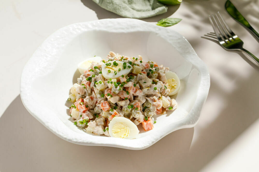 Homemade "Olivier" salad with sausage