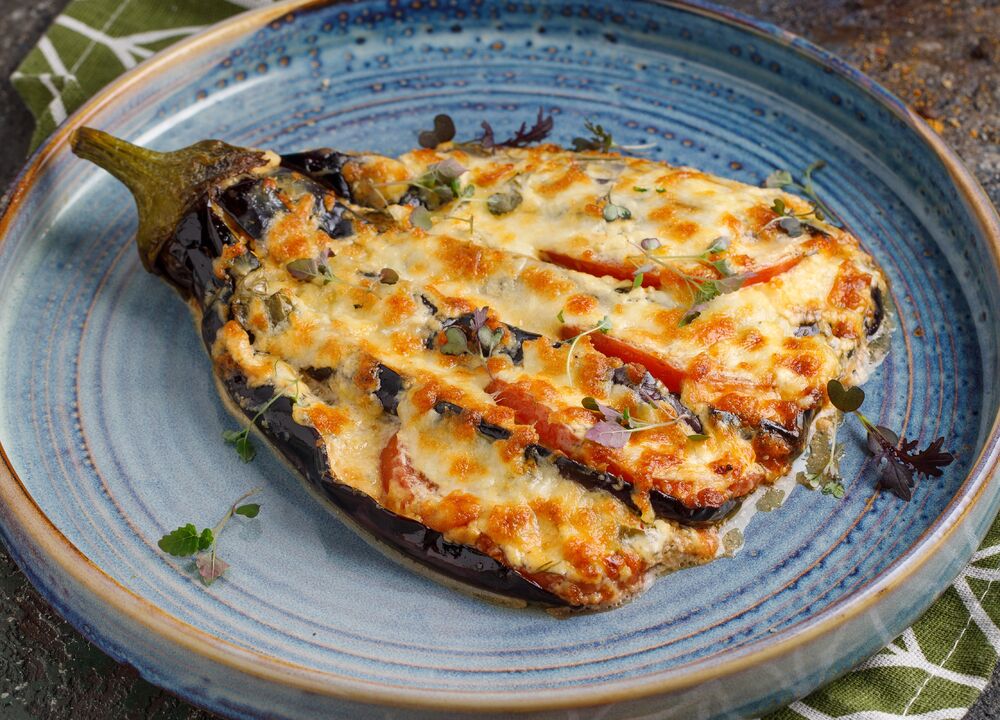 Fan of eggplant with tomatoes and Suluguni cheese
