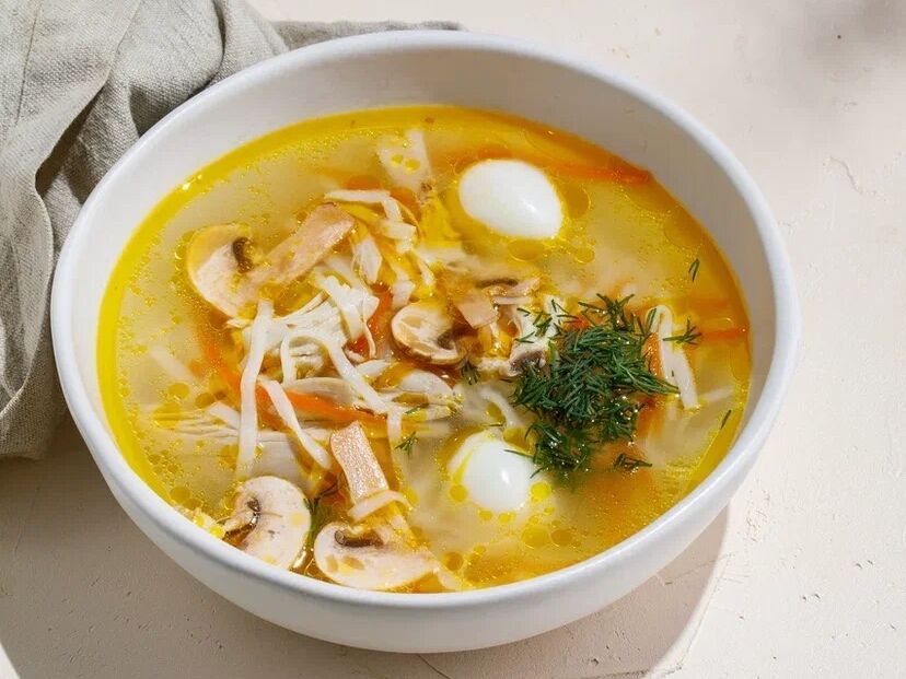 Homemade noodle soup with chicken and mushrooms