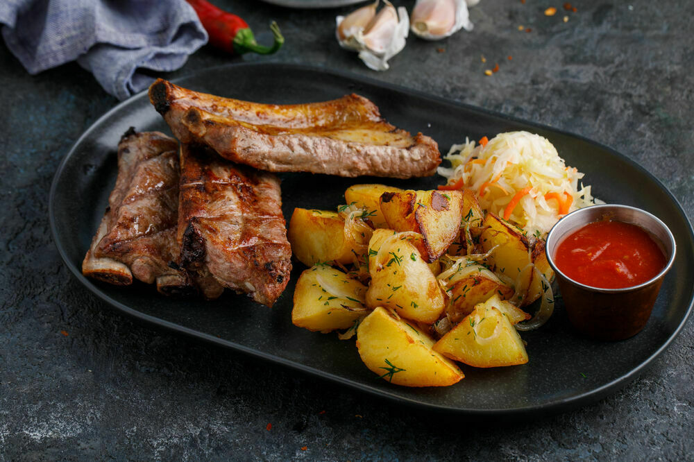 Charcoal ribs with golden potatoes
