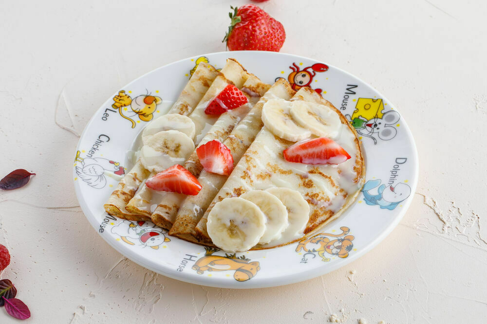 Children's pancakes with banana and condensed milk