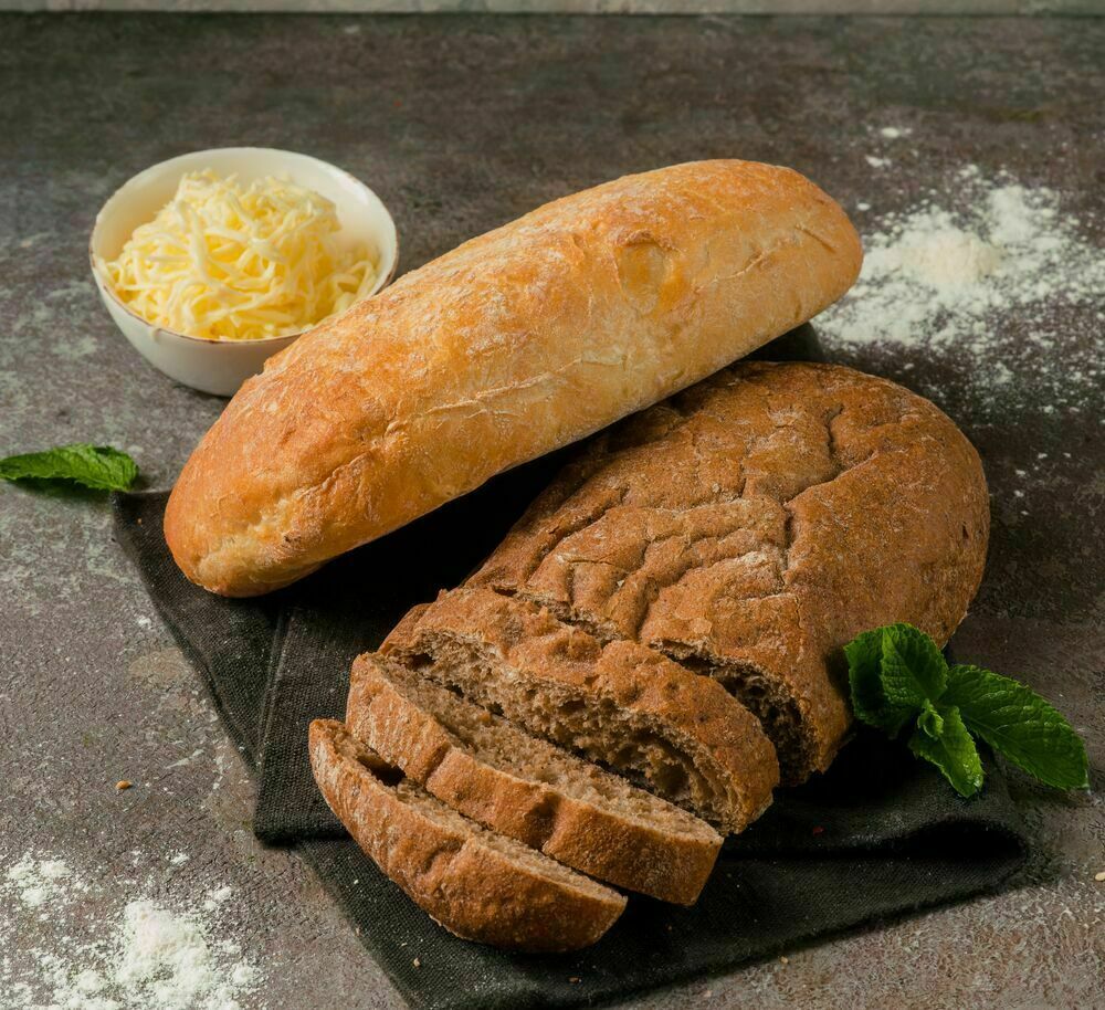Homemade dark bread with garlic sauce