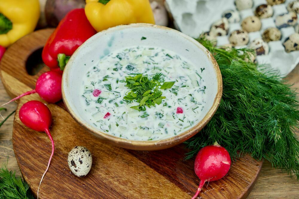 Homemade okroshka on yogurt with sausage