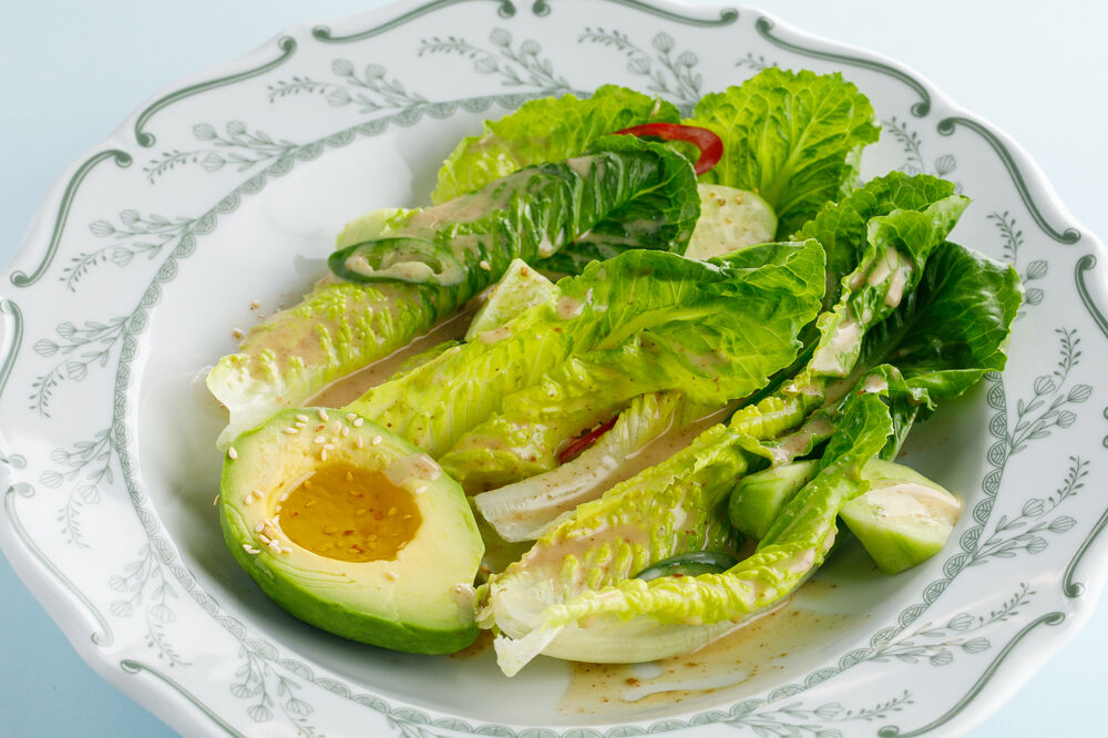 Green salad with avocado and nut dressing