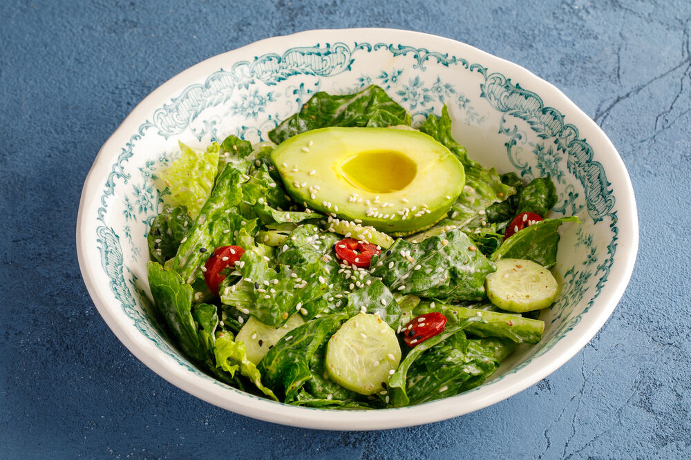 Green salad with avocado and nut dressing
