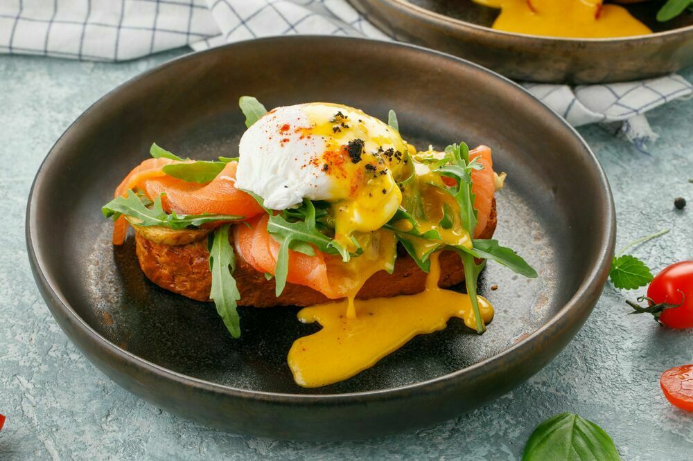 Egg benedict with trout and rye bread