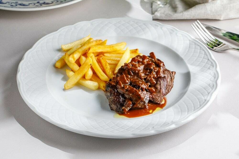 Filet mignon with porcini mushroom sauce and French fries