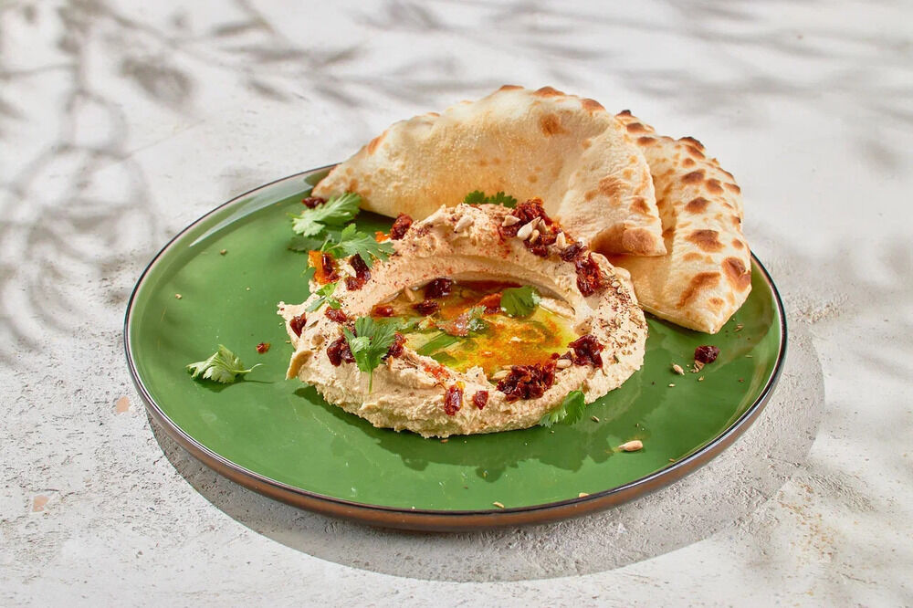  Hummus with olives and wood-fired pita bread